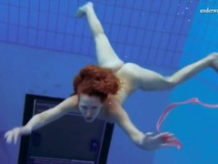 UhBabe presents: Curly hair redhead swims and looks sexy