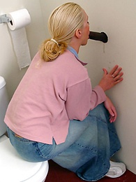 UhBabe presents: Blonde girl Jamie sits on the toilet and blows a black gloryhole dong